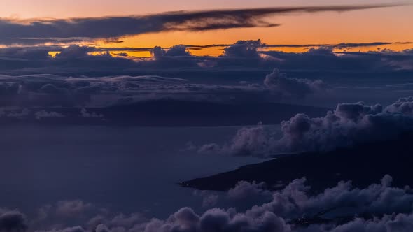 Sunset Over The Clouds