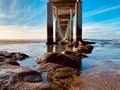Under the pier at low tide changes the beautiful terrain as it ebbs and flows.  - PhotoDune Item for Sale