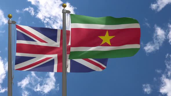 United Kingdom Flag Vs Suriname Flag On Flagpole