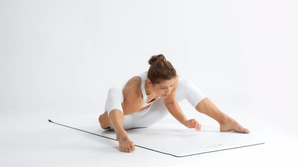 Senior Woman in White Space Practice Yoga