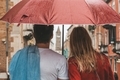 Are you from behind couple standing under the rain and the umbrella of a look in city of Venice - PhotoDune Item for Sale