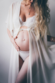 Pregnant woman holding her belly - PhotoDune Item for Sale