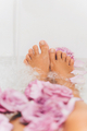 Point of view Female feet bathing in rose flowers - PhotoDune Item for Sale