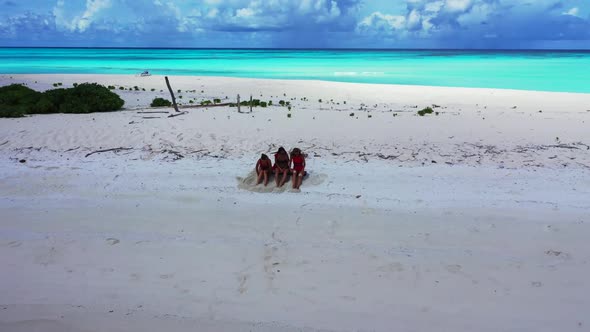 Women tan on idyllic sea view beach vacation by clear water with white sand background of the Maldiv