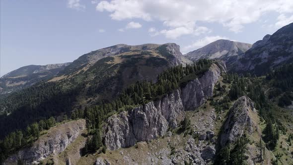 Aerial Zoom Out of Rugged Rugova Mountains of Kosovo in Daylight