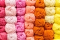 Selection of colorful yarn wool on shopfront. Knitting background. Knitting balls of wool - PhotoDune Item for Sale