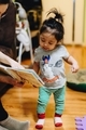 Parenthood, parenting, mother at home reading to her diverse toddler daughter, early education - PhotoDune Item for Sale