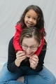 Mother and diverse daughter at home laughing and having fun, family, family bonding  - PhotoDune Item for Sale