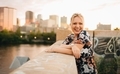 City portrait of happy blond young millennial girl laughing towards the camera  - PhotoDune Item for Sale