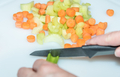 healthy eating: woman cutting vegetables with knife - PhotoDune Item for Sale