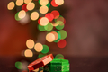 Out of focus Christmas lights and gift box - PhotoDune Item for Sale
