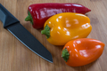 Mini Sweet Peppers  with knife on Cutting Board - PhotoDune Item for Sale