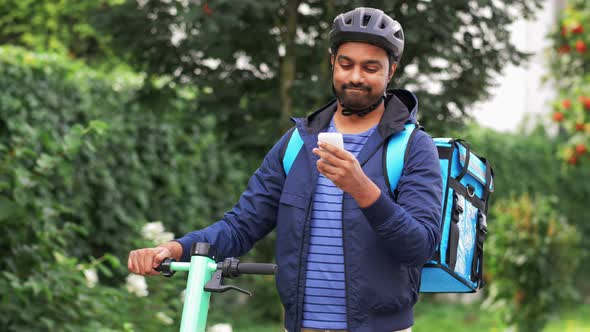 Delivery Man with Phone and Bag Riding Scooter