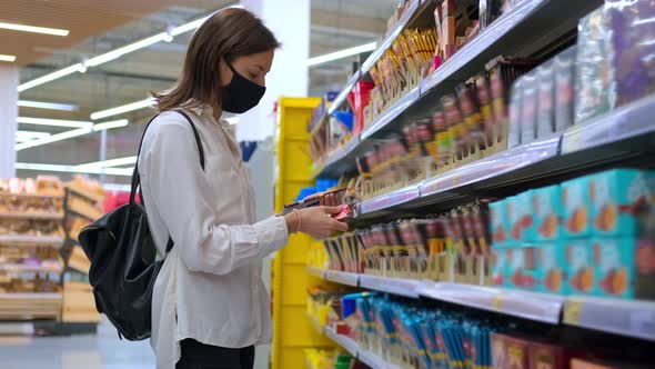 Buying Sweets and Chocolate in the Grocery / Videohive