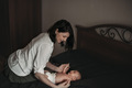 Mom is holding a newborn baby in her arms - PhotoDune Item for Sale