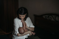 Mom is holding a newborn baby in her arms - PhotoDune Item for Sale