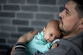Dad has a newborn baby in his arms - PhotoDune Item for Sale