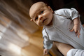 Mom is holding a newborn baby in her arms - PhotoDune Item for Sale
