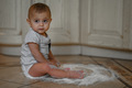 The baby at home in the kitchen got dirty in flour - PhotoDune Item for Sale