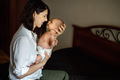 Mom is holding a newborn baby in her arms - PhotoDune Item for Sale