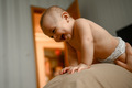 A happy baby is lying on his father's breast - PhotoDune Item for Sale