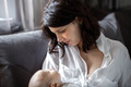mom breastfeeds the baby - PhotoDune Item for Sale