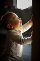 Portrait of a baby. Dark key. A child in the rays of light - PhotoDune Item for Sale