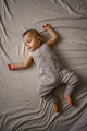 A little boy sleeps sweetly on the bed - PhotoDune Item for Sale
