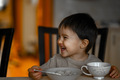 A little boy eats porridge for breakfast - PhotoDune Item for Sale