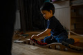 A little boy plays a wooden railway - PhotoDune Item for Sale