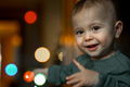 Portrait of a one-year-old baby, the child plays with a glowing garland - PhotoDune Item for Sale
