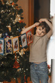 Boys decorate the Christmas tree. - PhotoDune Item for Sale
