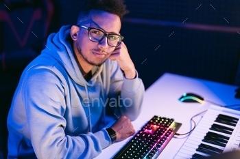 Man working in a modern technological sound and visual studio