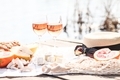 Stylish summer picnic with fruits, sweets and wine on a white blanket.  - PhotoDune Item for Sale