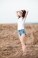Hipster girl wearing blank white t-shirt and denim shorts - PhotoDune Item for Sale