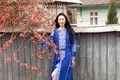 Beautiful girl with long brunette hair in blue dress. Traditional clothes of Ukrainian region. - PhotoDune Item for Sale