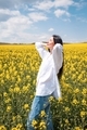 Young happy woman enjoying canola field. NO FILTER, NATURAL LIGHT - PhotoDune Item for Sale