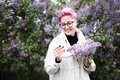Beautiful Young Woman with Pink Hair holding Lilac bouquet. - PhotoDune Item for Sale