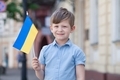 little boy with Ukrainian flag in hand - PhotoDune Item for Sale