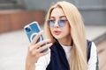 woman uses mobile phone for chatting online - PhotoDune Item for Sale