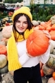 Young pretty woman holding orange halloween pumpkin - PhotoDune Item for Sale