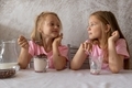 Children eat a ready-made breakfast of chocolate balls with milk in the morning. Balanced nutrition. - PhotoDune Item for Sale