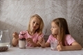 Children eat a ready-made breakfast of chocolate balls with milk in the morning. Balanced nutrition. - PhotoDune Item for Sale