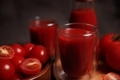 Tomato juice poured into glasses and tomato fruits lying nearby. - PhotoDune Item for Sale