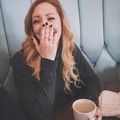 Young woman laughs and covers her mouth with her hand  - PhotoDune Item for Sale