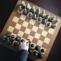 Hand in frame on a pawn making a first move in a chess game - PhotoDune Item for Sale