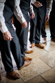 Looking down at similarly dressed men in a wedding party as they wait for the ceremony to begin - PhotoDune Item for Sale