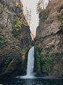 The sun peers through the rocks at Wahclella Falls in Cascade Locks, Oregon - PhotoDune Item for Sale
