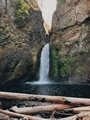 The sun peers through the rocks at Wahclella Falls in Cascade Locks, Oregon - PhotoDune Item for Sale