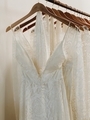 Beautiful wedding gowns arranged on wood hangers in an elegant bridal shop - PhotoDune Item for Sale